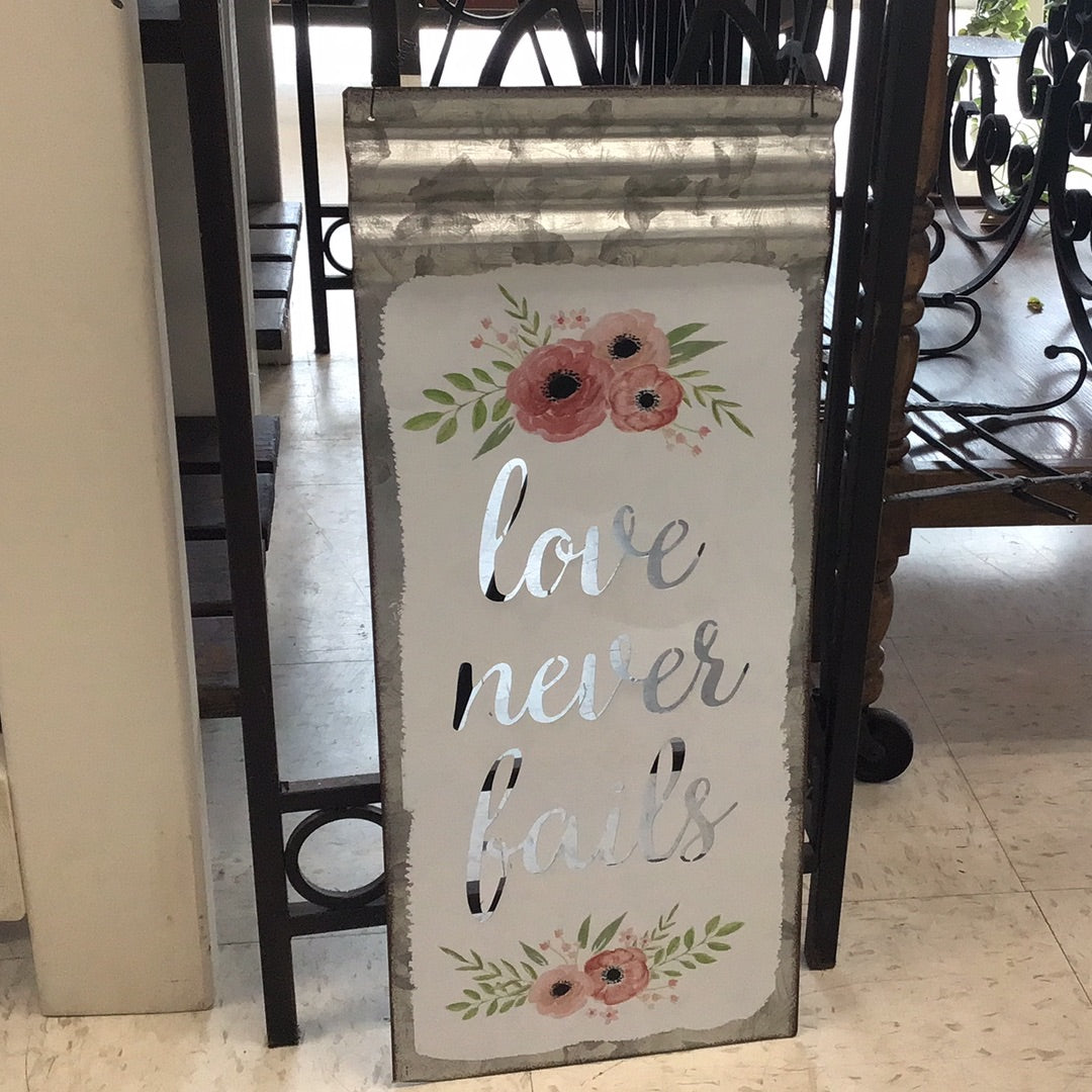 Love Never Fails Metal Sign